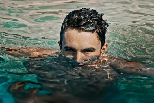 man swimming to build muscle